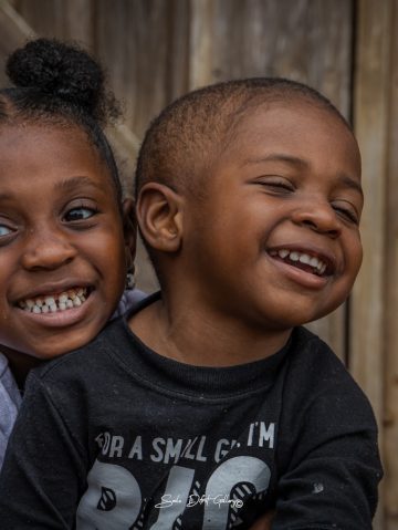 Photo by Smile Difrnt a couple of kids sitting next to each other