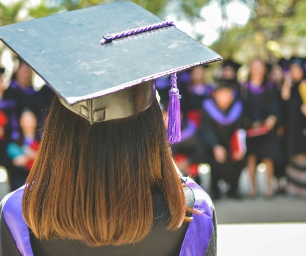 Photo by MD Duran woman wearing academic cap and dress selective focus photography