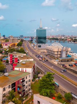 Photo by Nupo Deyon Daniel city skyline under blue sky during daytime